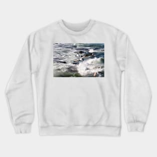 Seagulls flying over the crashing waves, Seahouses, Northumberland, UK Crewneck Sweatshirt